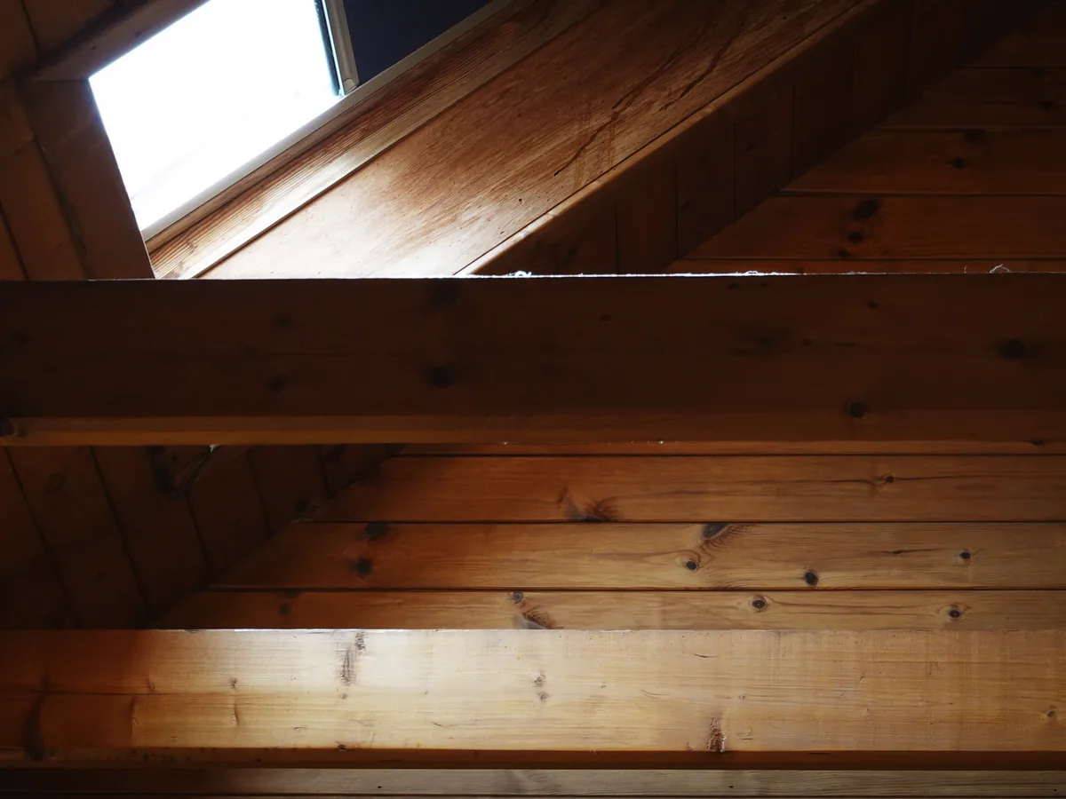 Spray foam and a radiant barrier applied at a Florida roof deck to bring the attic into the conditioned envelope