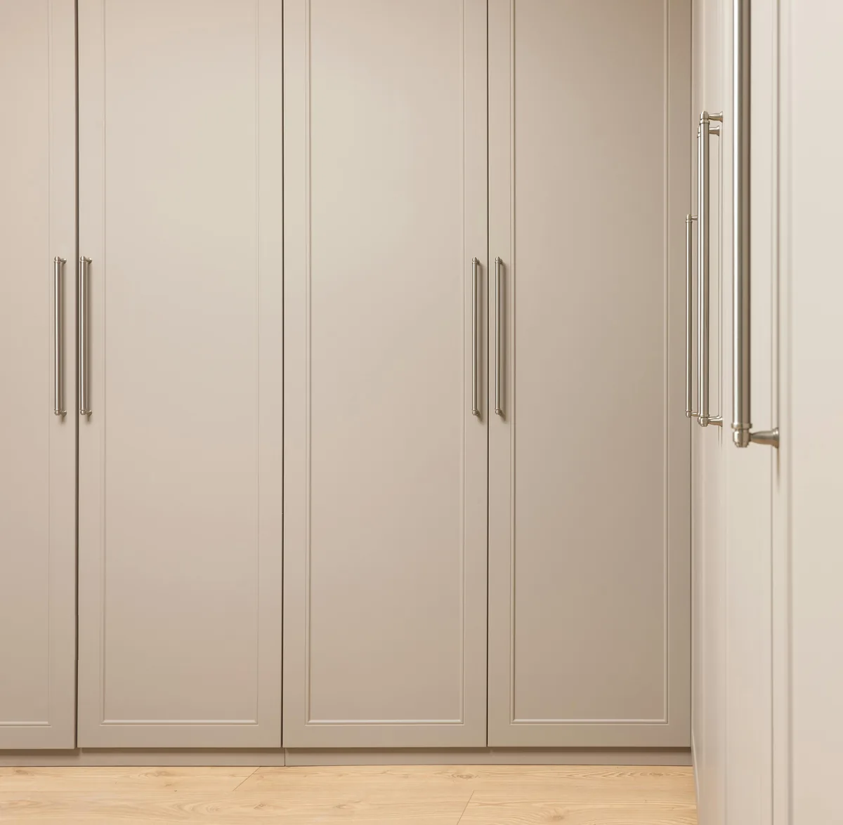 Custom walk-in closet system with drawer banks, double-hang sections, and ventilated shoe shelving in a Florida home