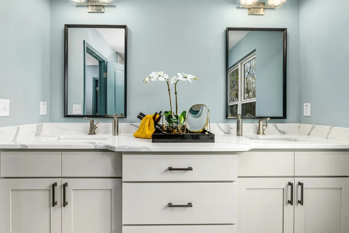 A double-vanity stone top being templated for undermount sinks during a Florida bathroom project