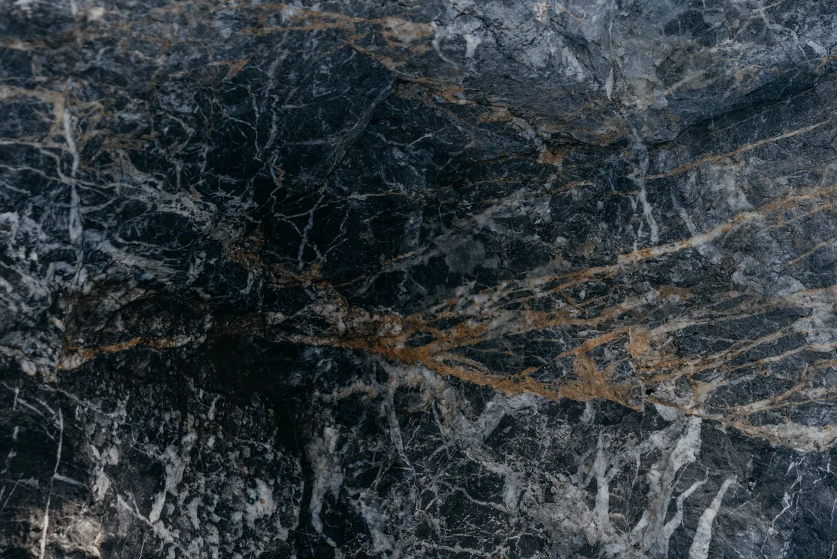 Close-up of a honed natural marble slab showing soft veining and a matte finish