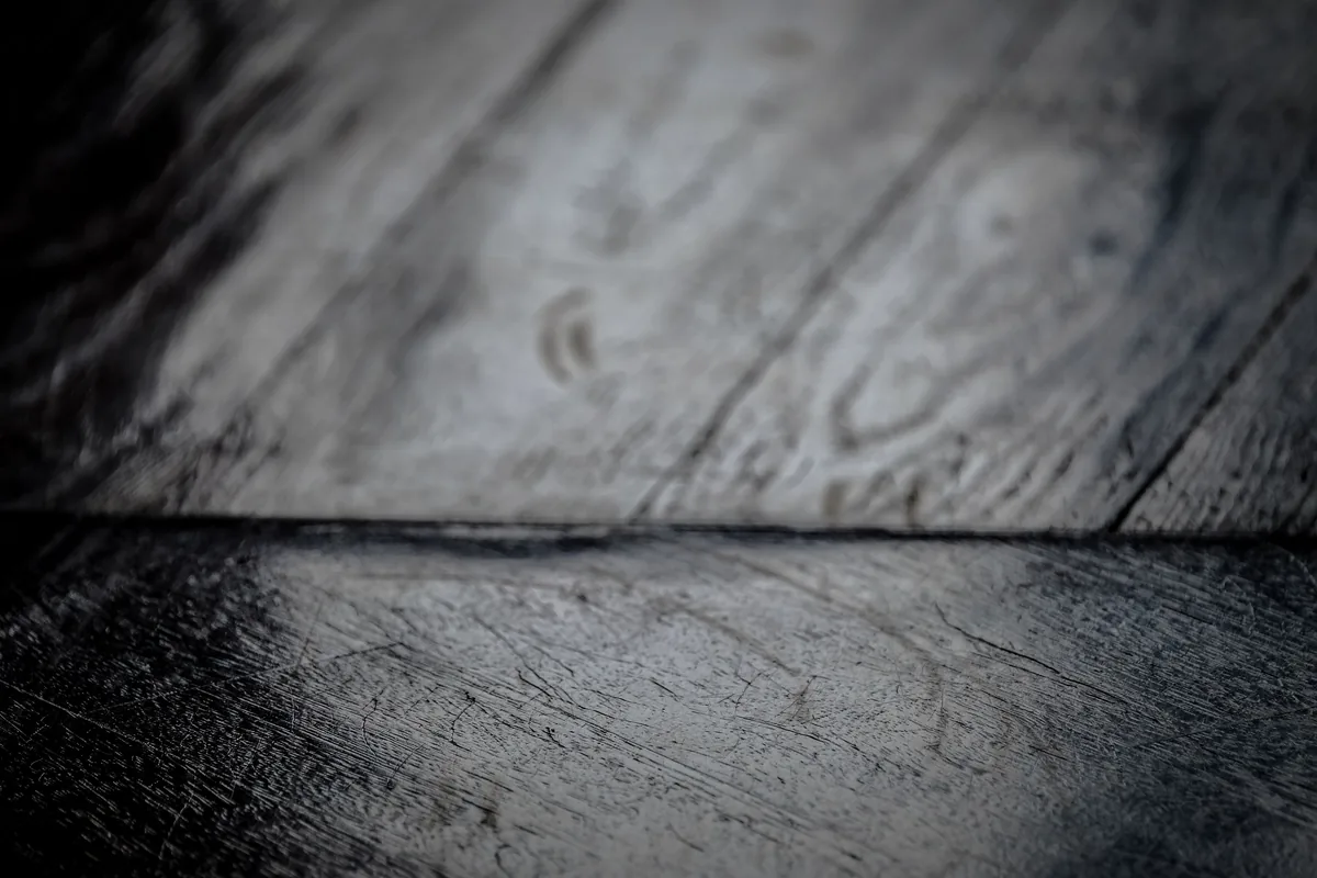 Close-up of cork flooring showing the air-cell structure that makes it cushioned and insulating