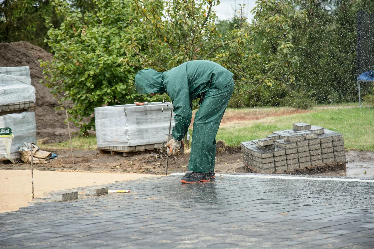 Installer sealing the surface of a cork floor in a Florida home to protect it from humidity