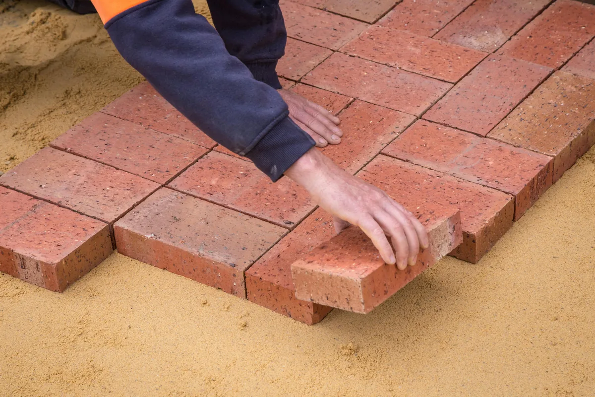 A roll-on vapor-mitigation coating being applied to a Florida concrete slab after a moisture test