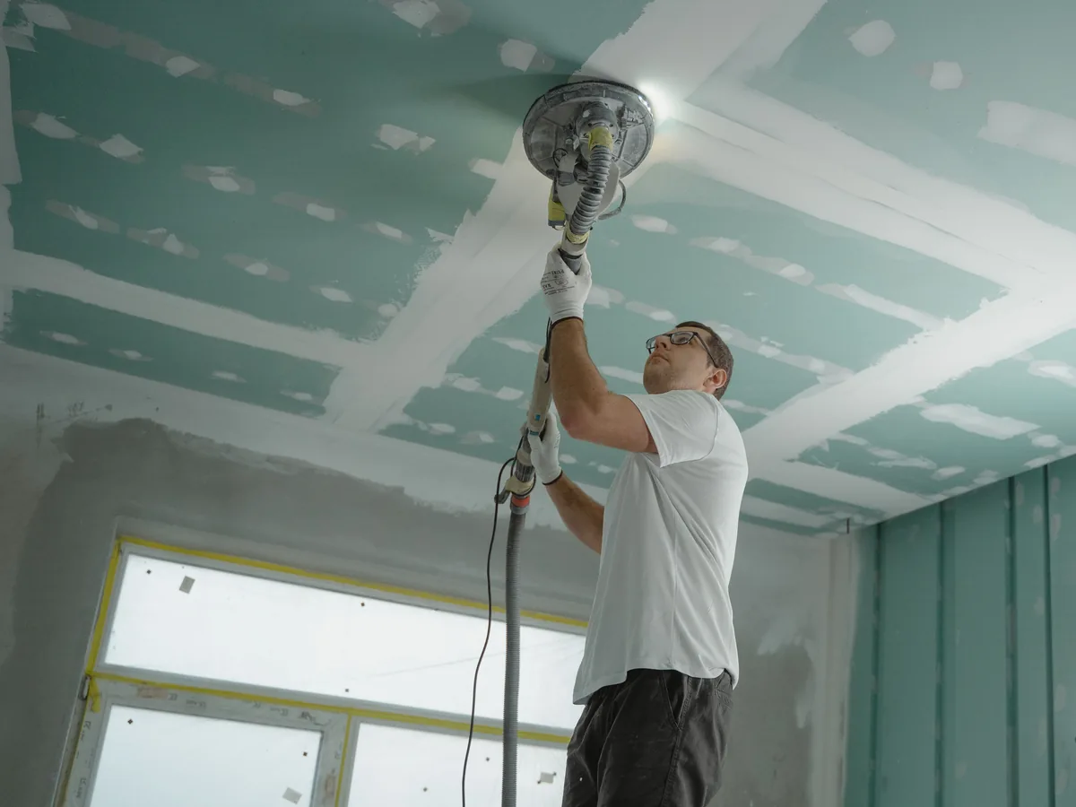 Mold-resistant board and waterproof flooring assembly being installed during a Florida renovation