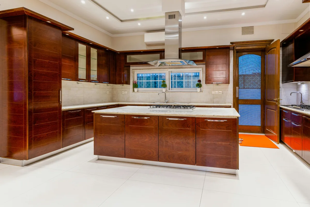 Electrical and plumbing routed through a Florida concrete slab to a new kitchen island location