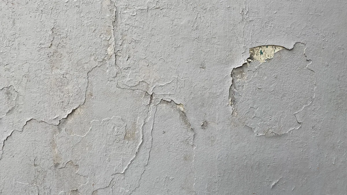 A water-stained Florida ceiling cut open to expose and correct the leak source before drywall repair